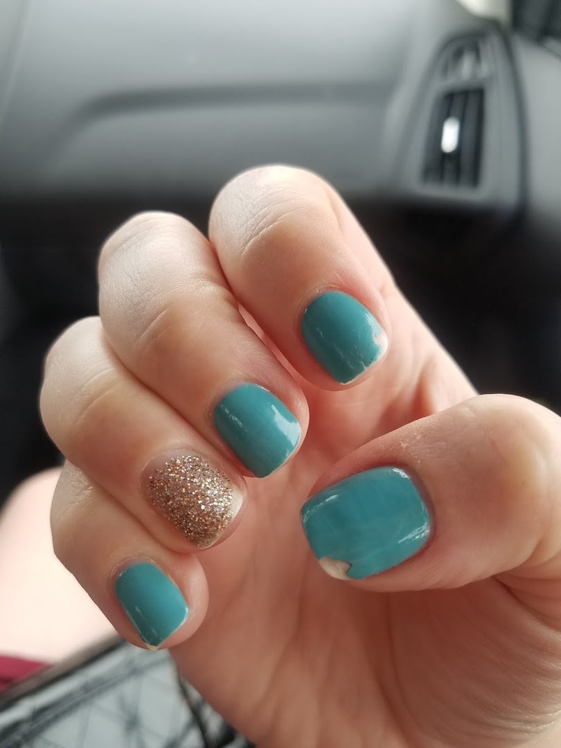 Close-up of polished nails and tools.